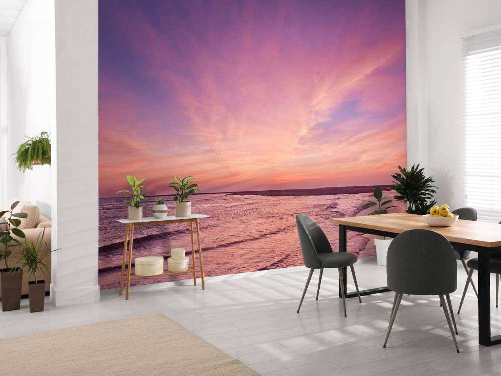 Playa con puesta de sol rosa