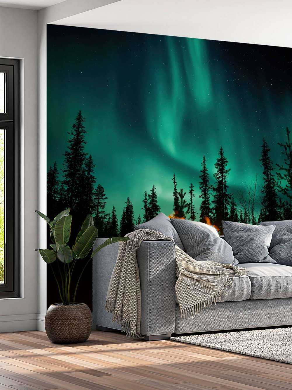 Fogata bajo la aurora boreal