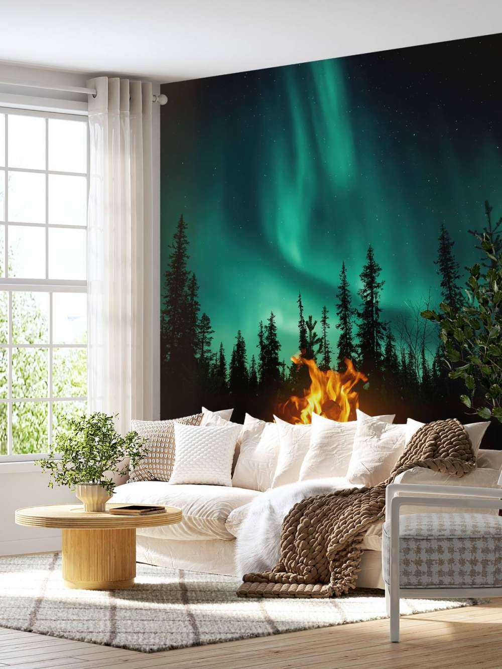 Fogata bajo la aurora boreal