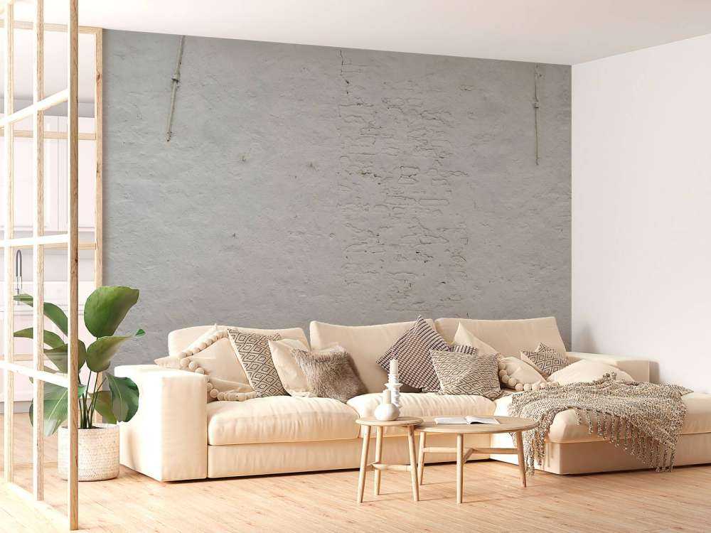 Pared con estuco blanco y anclajes de pared