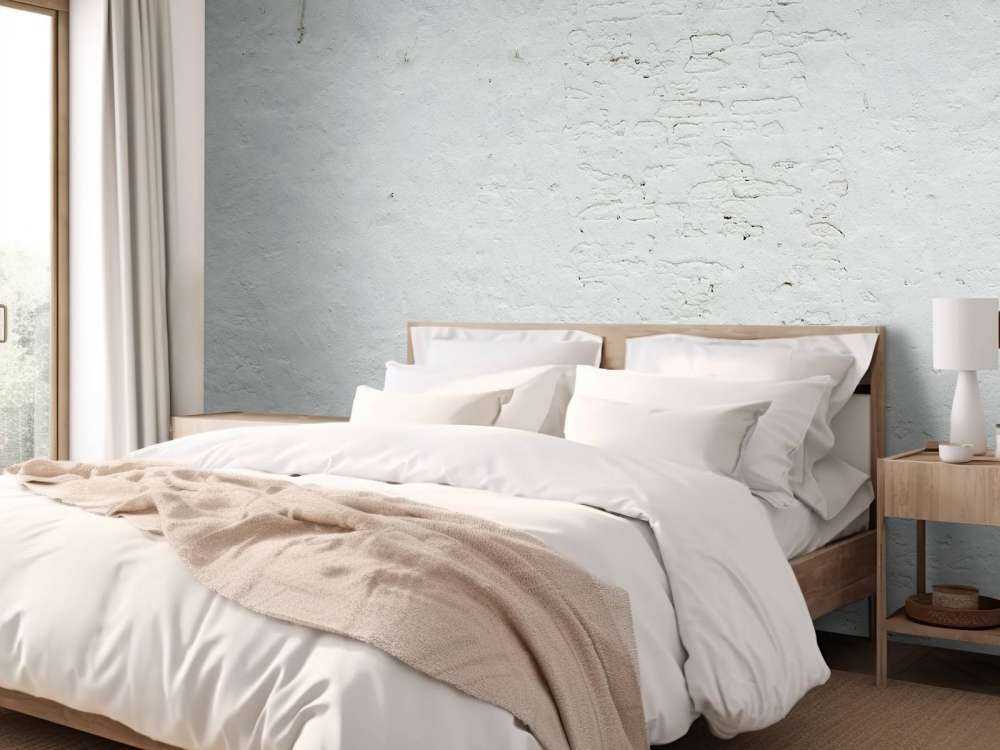 Pared con estuco blanco y anclajes de pared