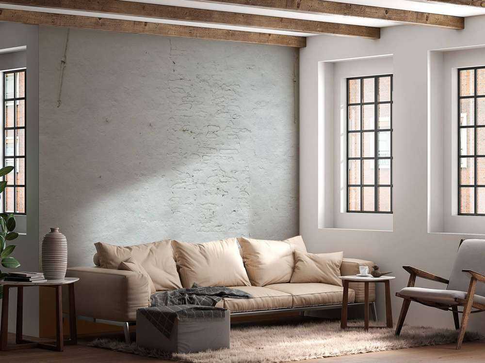 Pared con estuco blanco y anclajes de pared